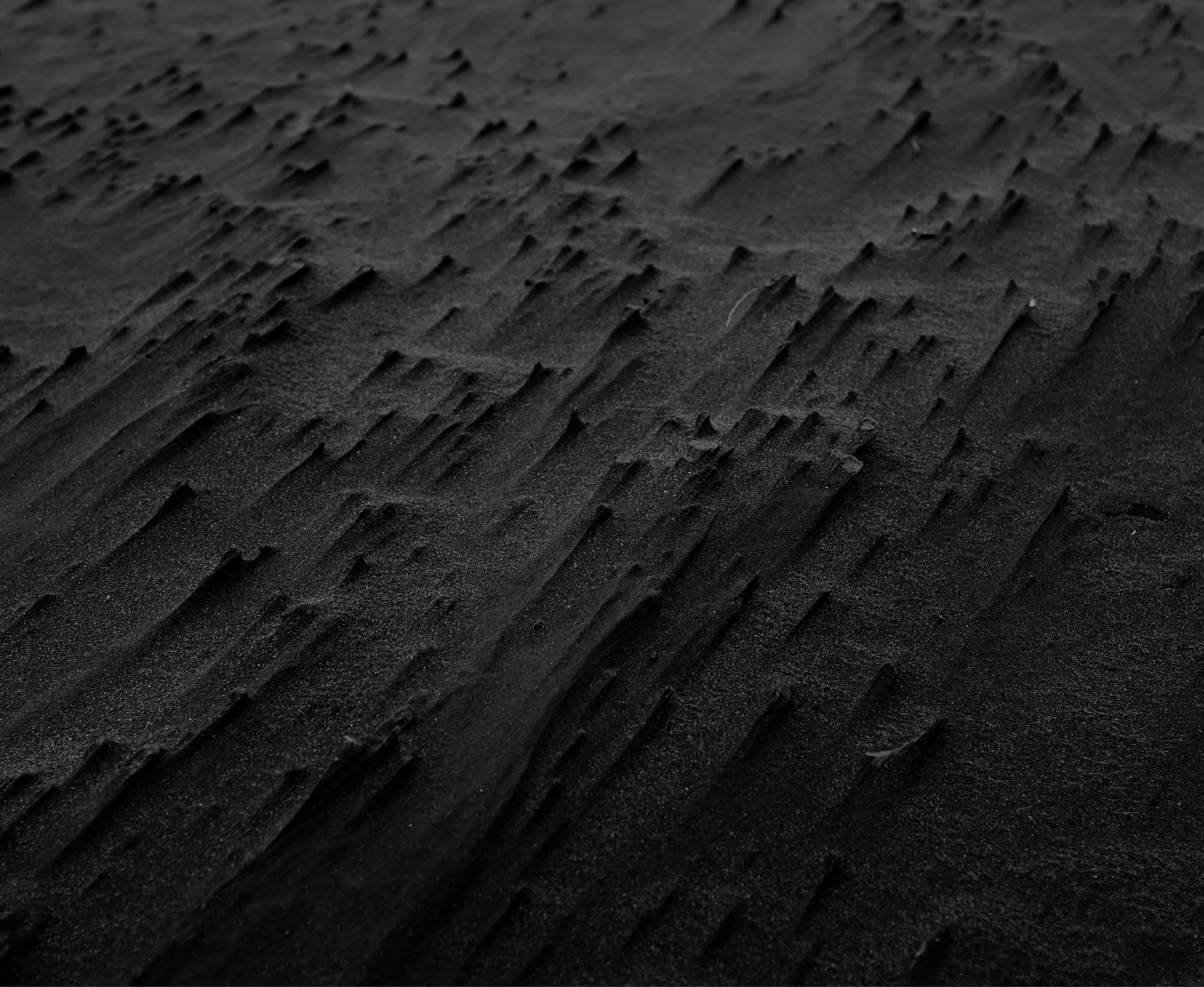 Background image of black sand